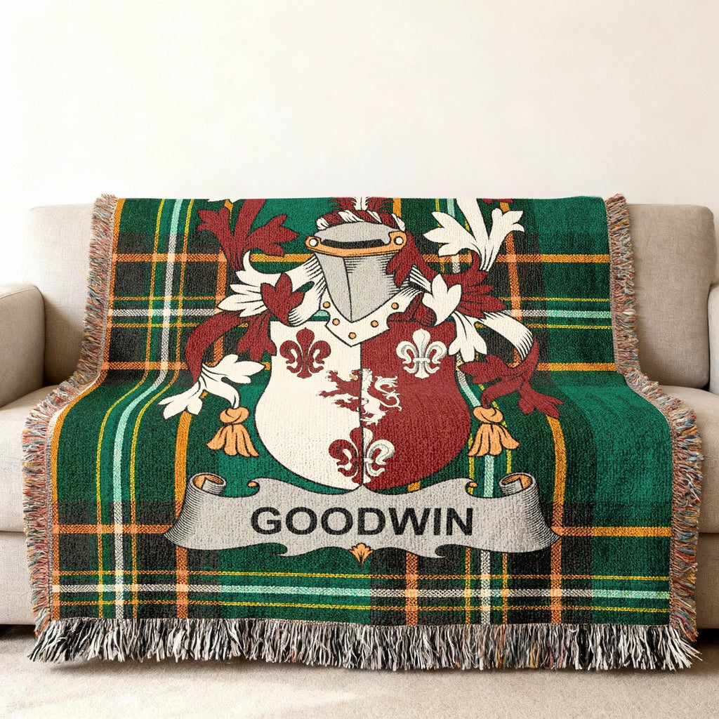 Green plaid woven blanket with Goodwin family crest.
