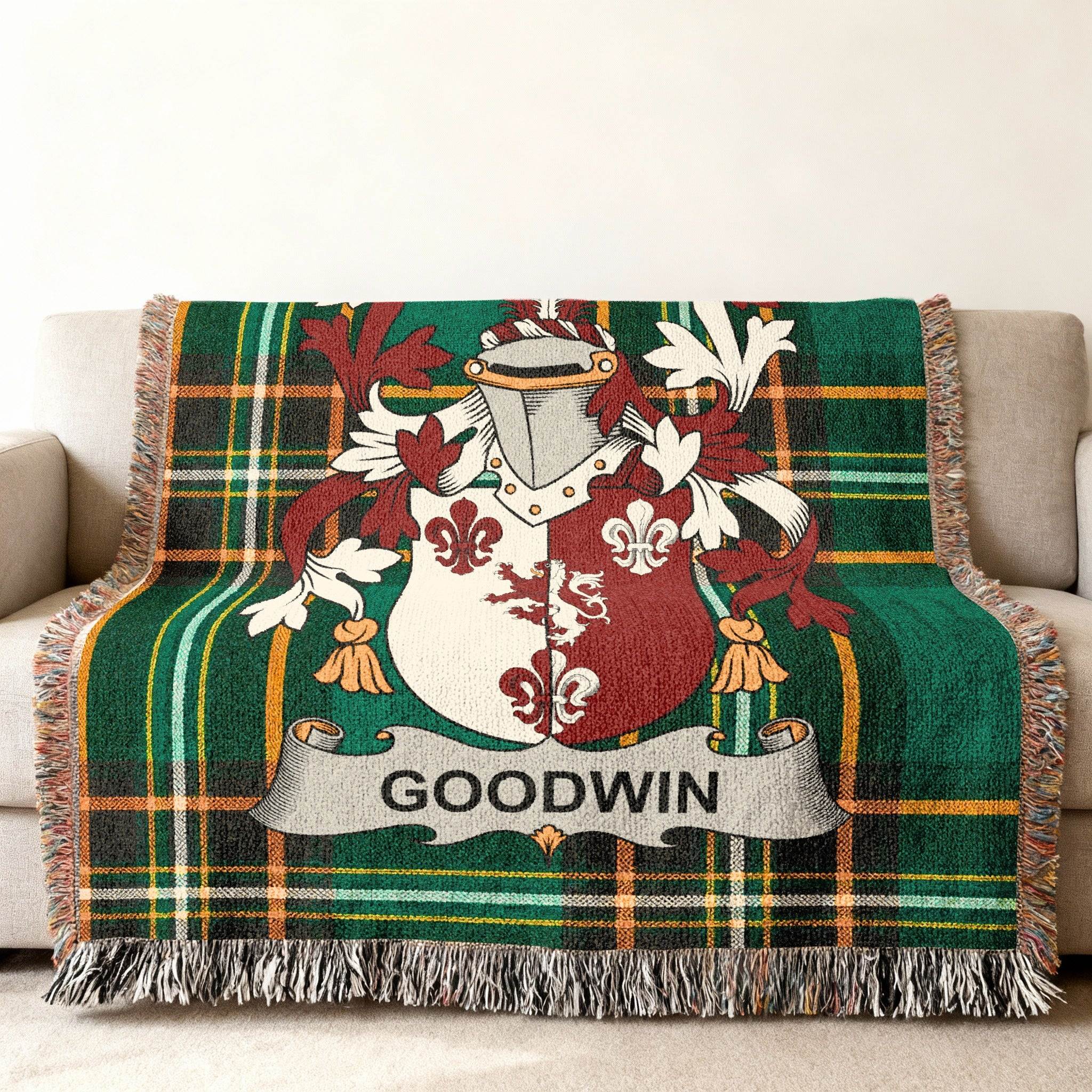 Green plaid woven blanket with Goodwin family crest.