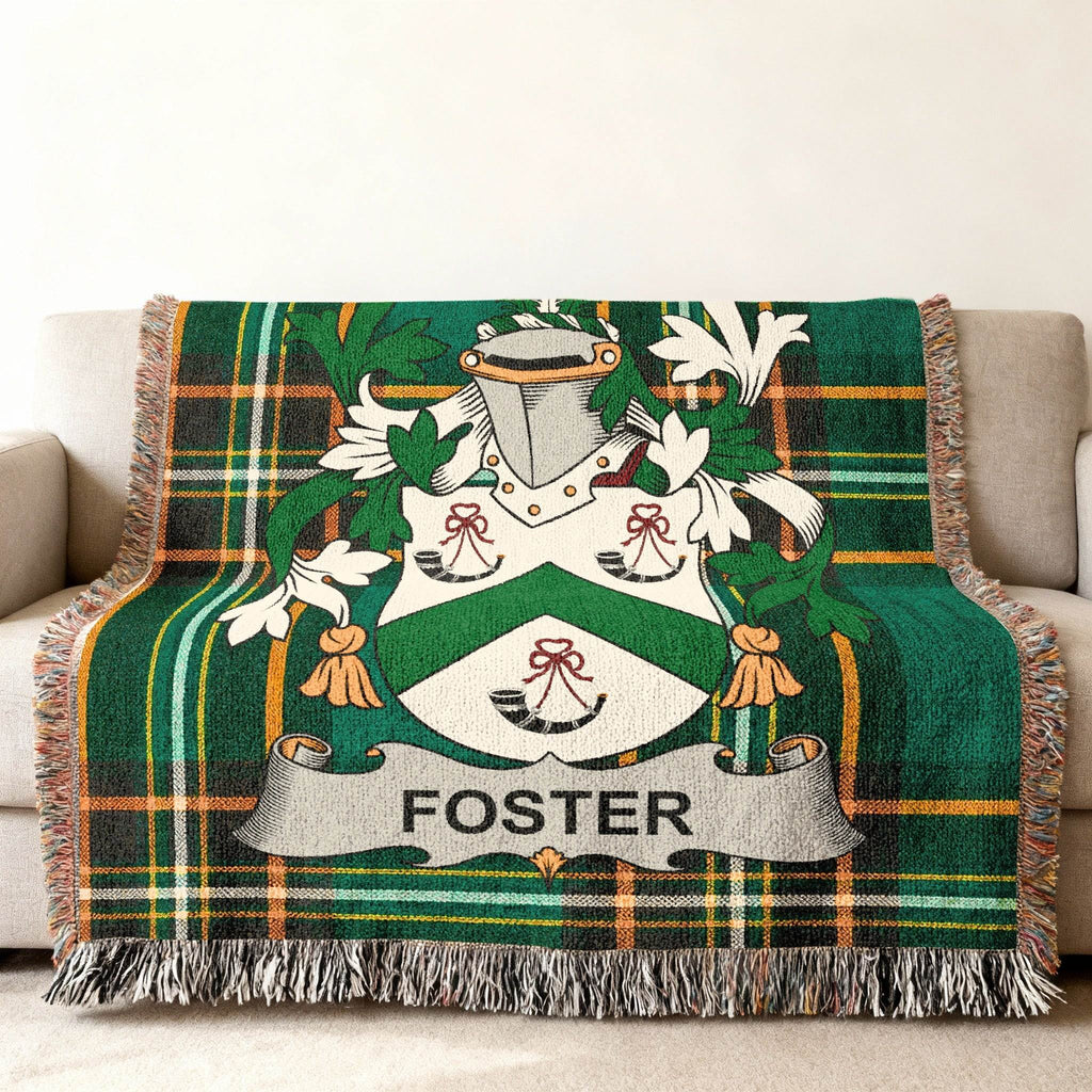 Green tartan throw blanket with the Foster family crest.