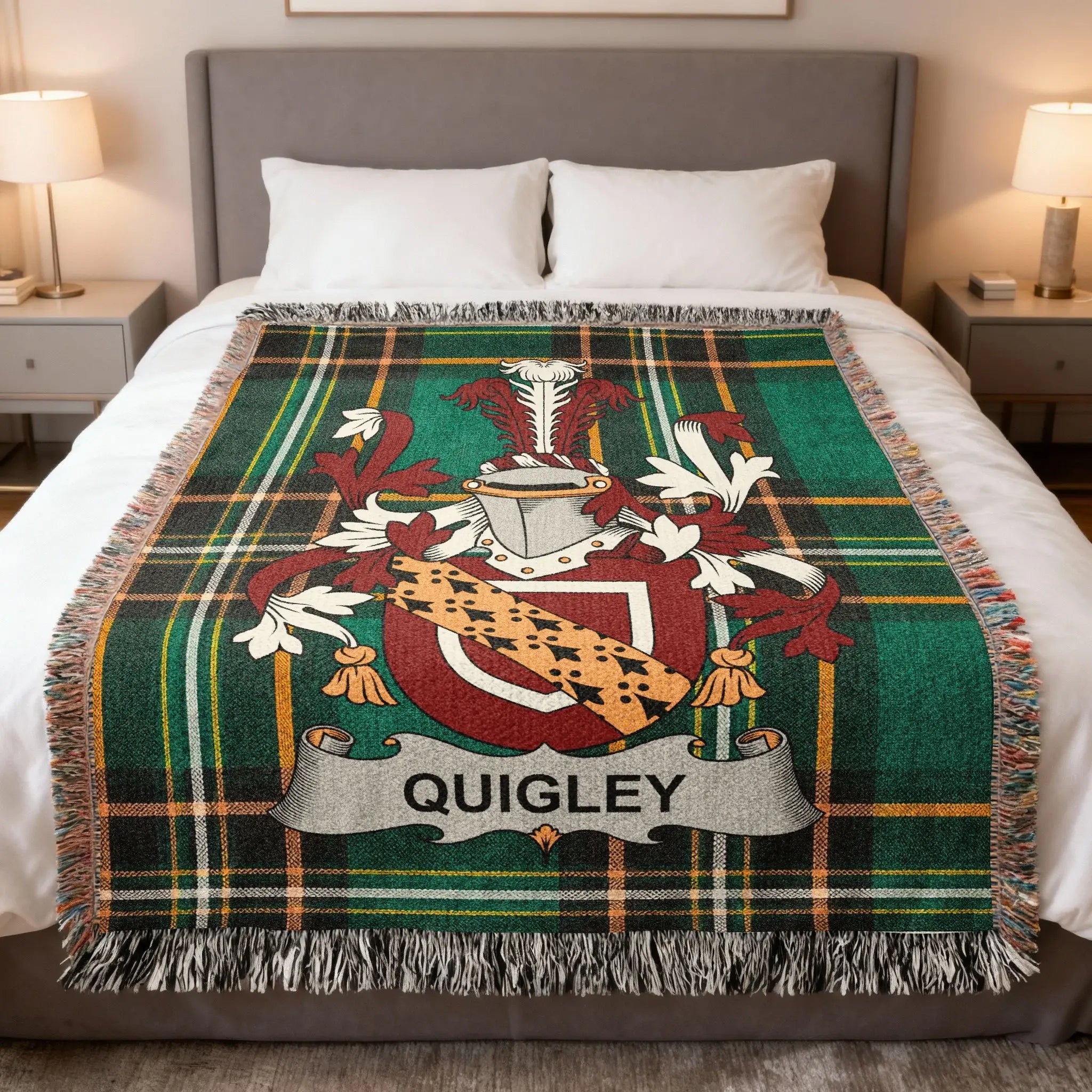 Plaid throw blanket with Quigley family crest on a bed.