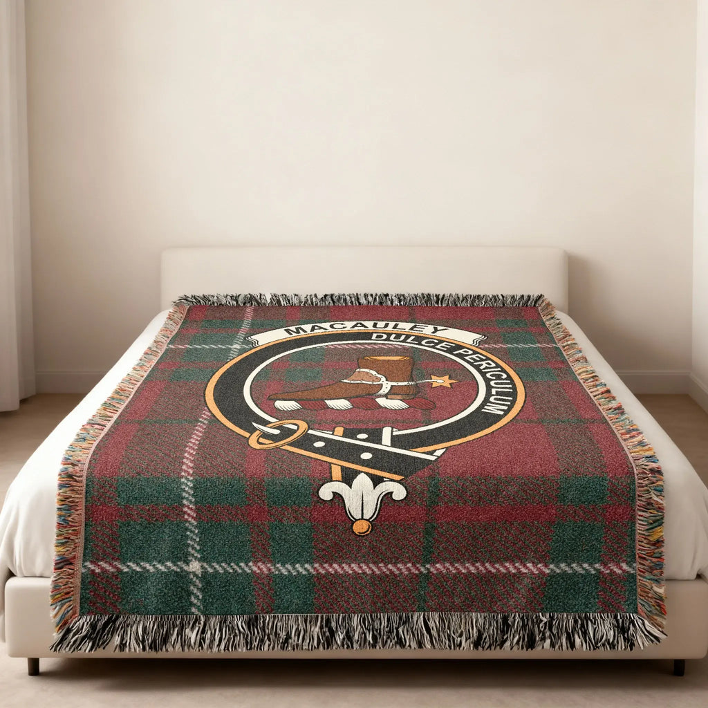Clan MacAulay Dulce Periculum woven blanket — lifestyle shot showing fringe border and tartan design