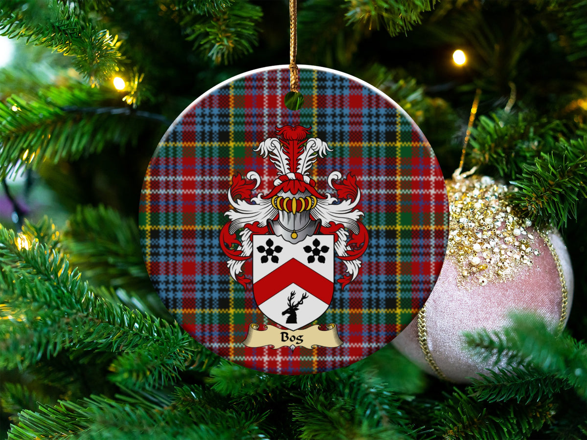 Bos Scottish clan ceramic ornament with family crest on a Caledonia tartan background, hanging on a Christmas tree