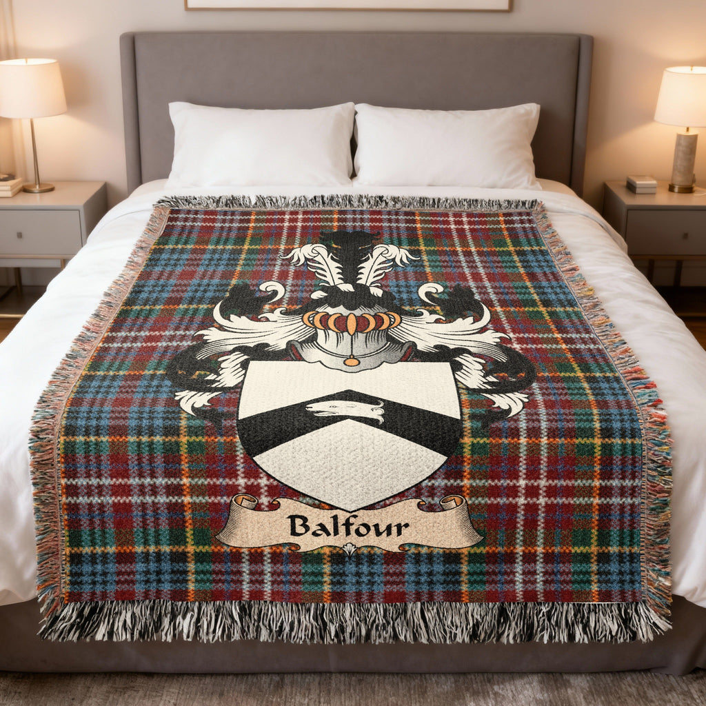 Balfour family crest emblem on a Caledonia tartan woven blanket