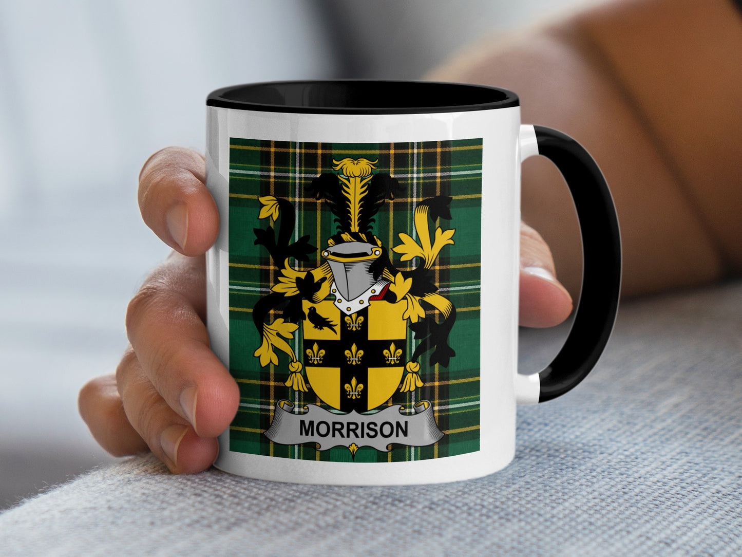 White mug with black rim featuring Morrison family crest on tartan background.