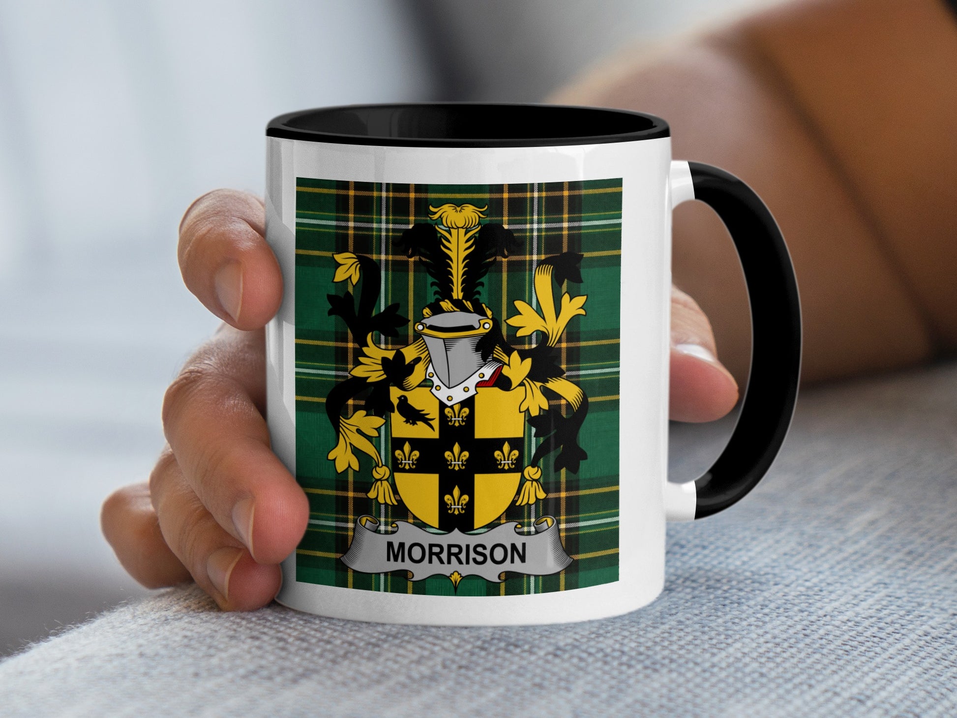White mug with black rim featuring Morrison family crest on tartan background.