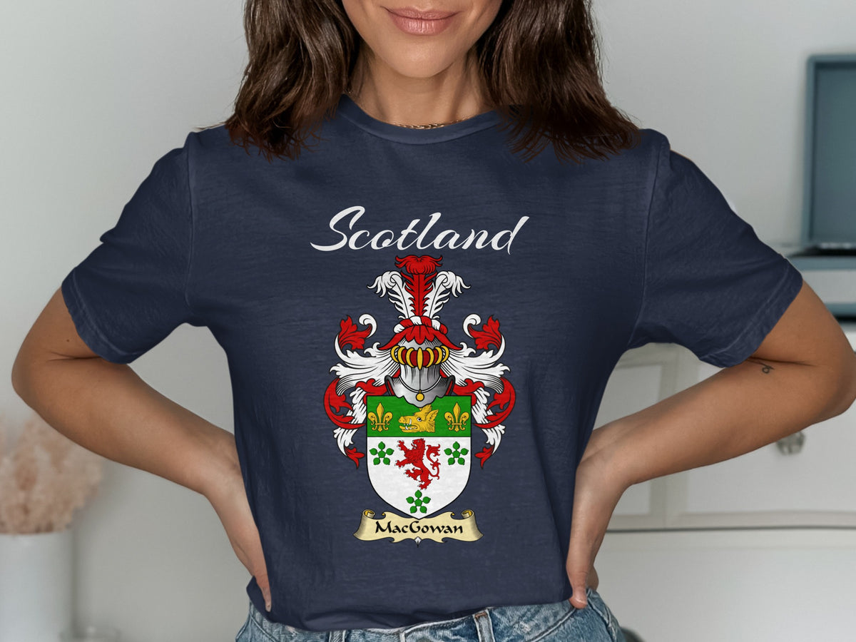 Model wearing a navy MacGowan T-shirt featuring a green-and-white shield with a red lion and clover motifs