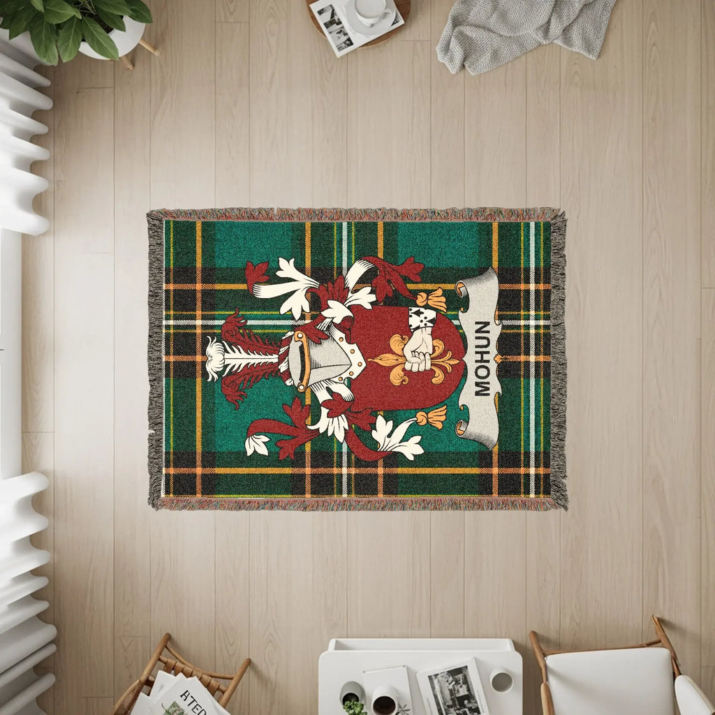 Mohun family crest woven blanket with plaid background.