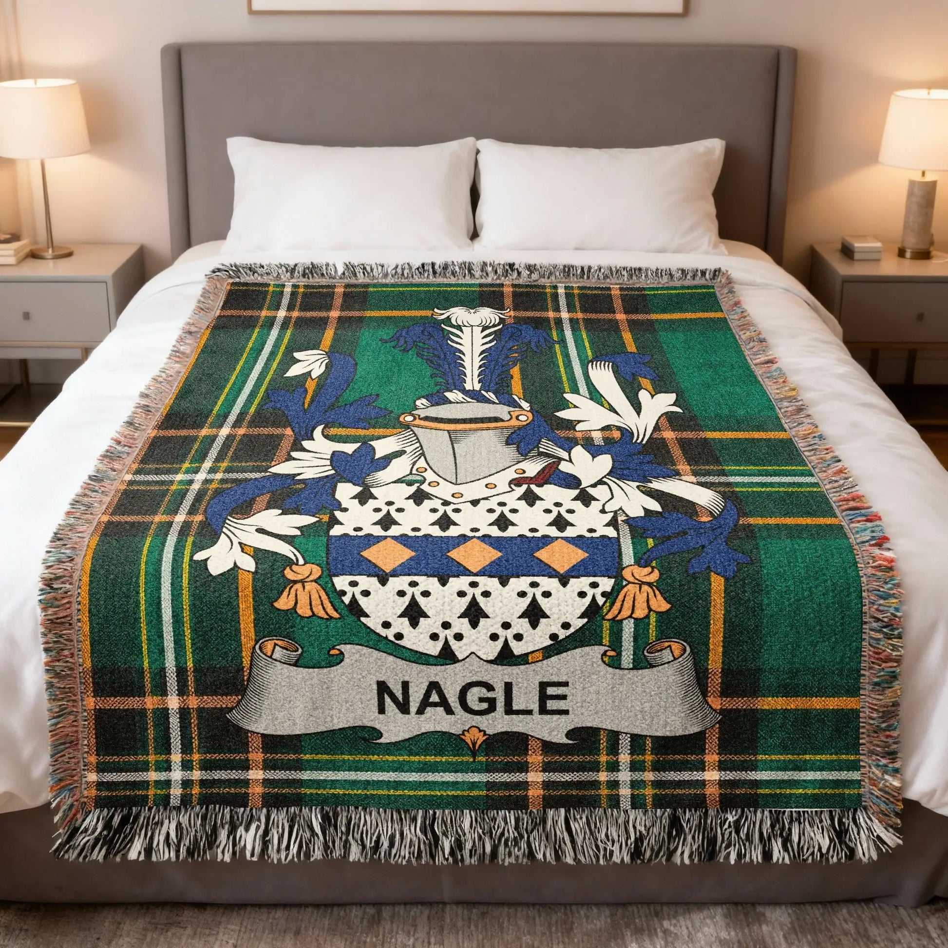 Nagle family crest on a green plaid woven throw blanket on a bed.