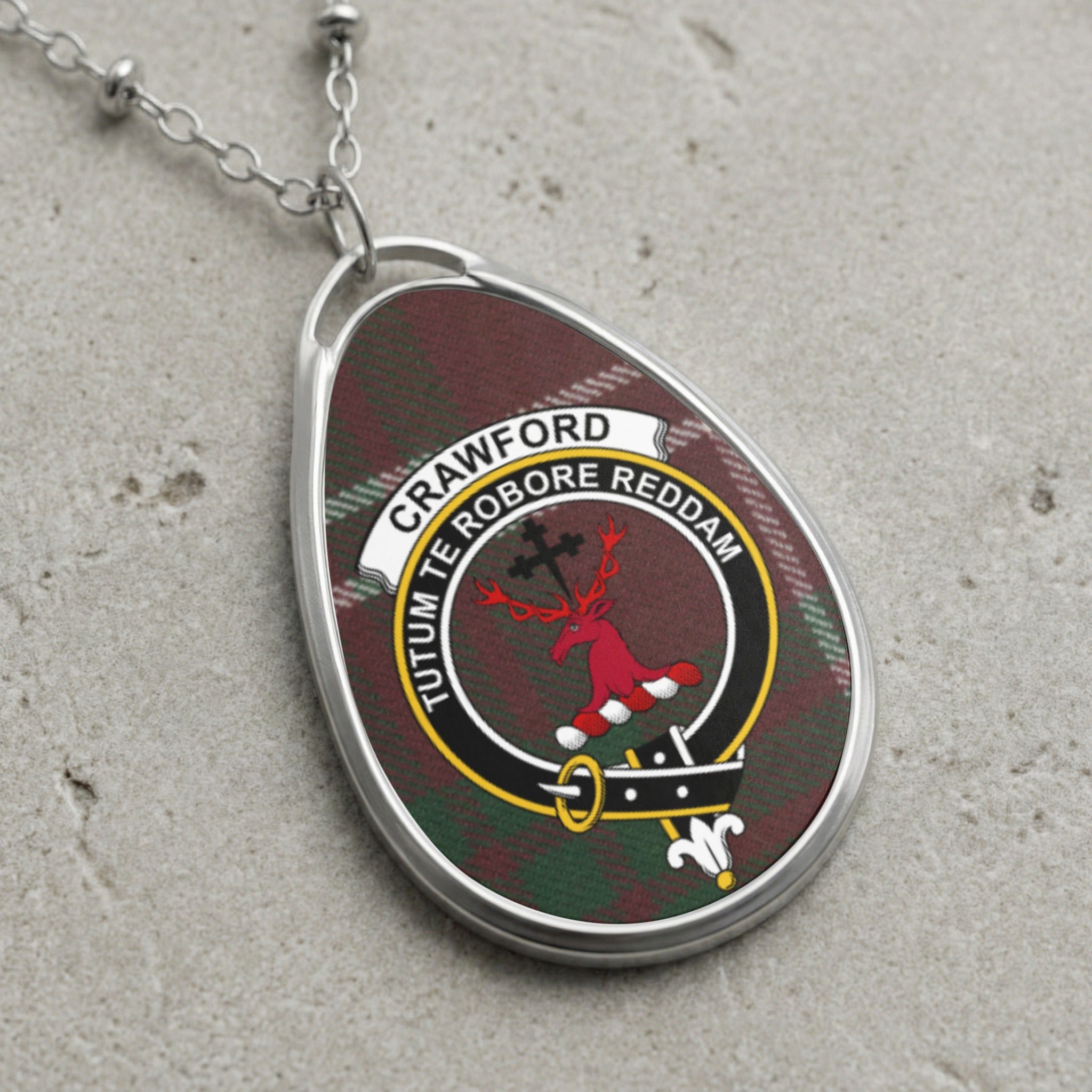 Crawford clan Scottish tartan necklace with clan crest on tartan background