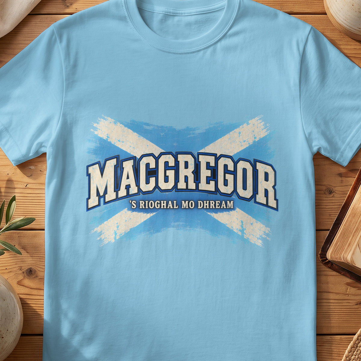 MacGregor Scottish Saltire T-shirt in Sky, with distressed blue and cream flag and “'S Rioghal Mo Dhream” lettering.