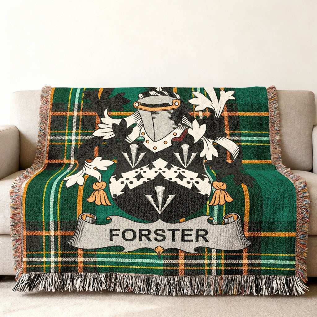 Forster family crest on a green and orange plaid woven blanket.