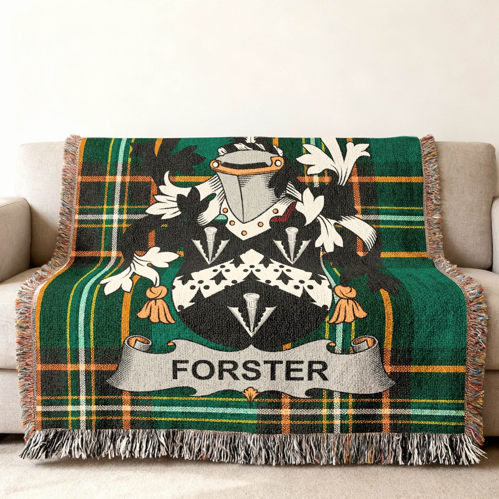 Forster family crest on a green and orange plaid woven blanket.