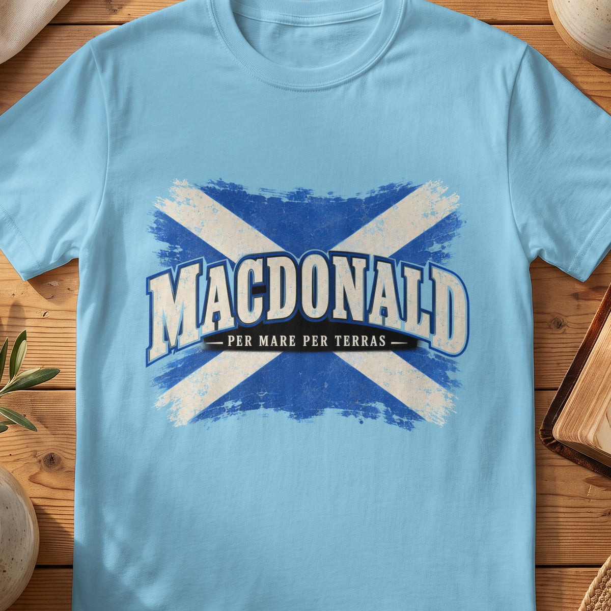 MacDonald Scottish Saltire T-shirt in Sky, with distressed blue and cream flag and “Per Mare Per Terras” lettering.