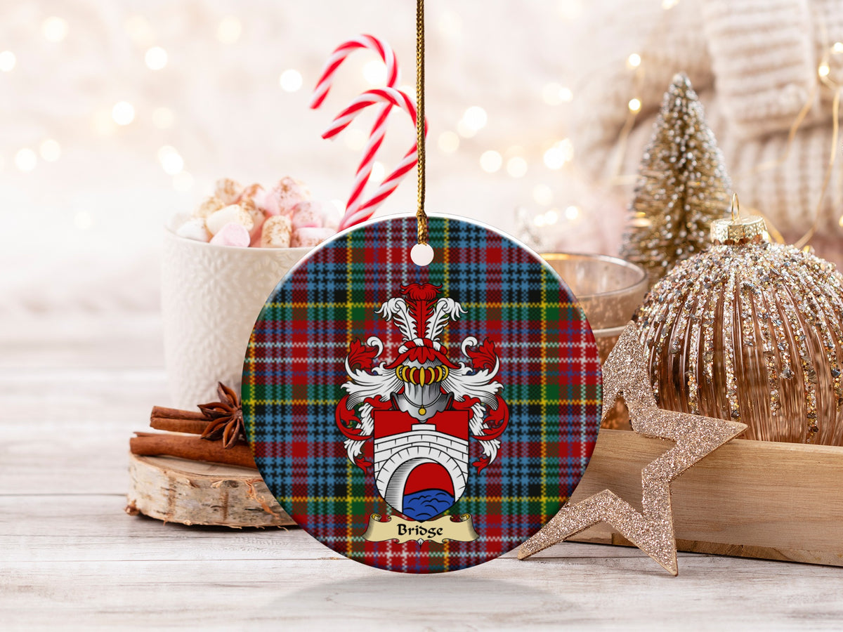 Bridge family emblem ceramic Christmas ornament with Caledonia tartan background in festive holiday décor