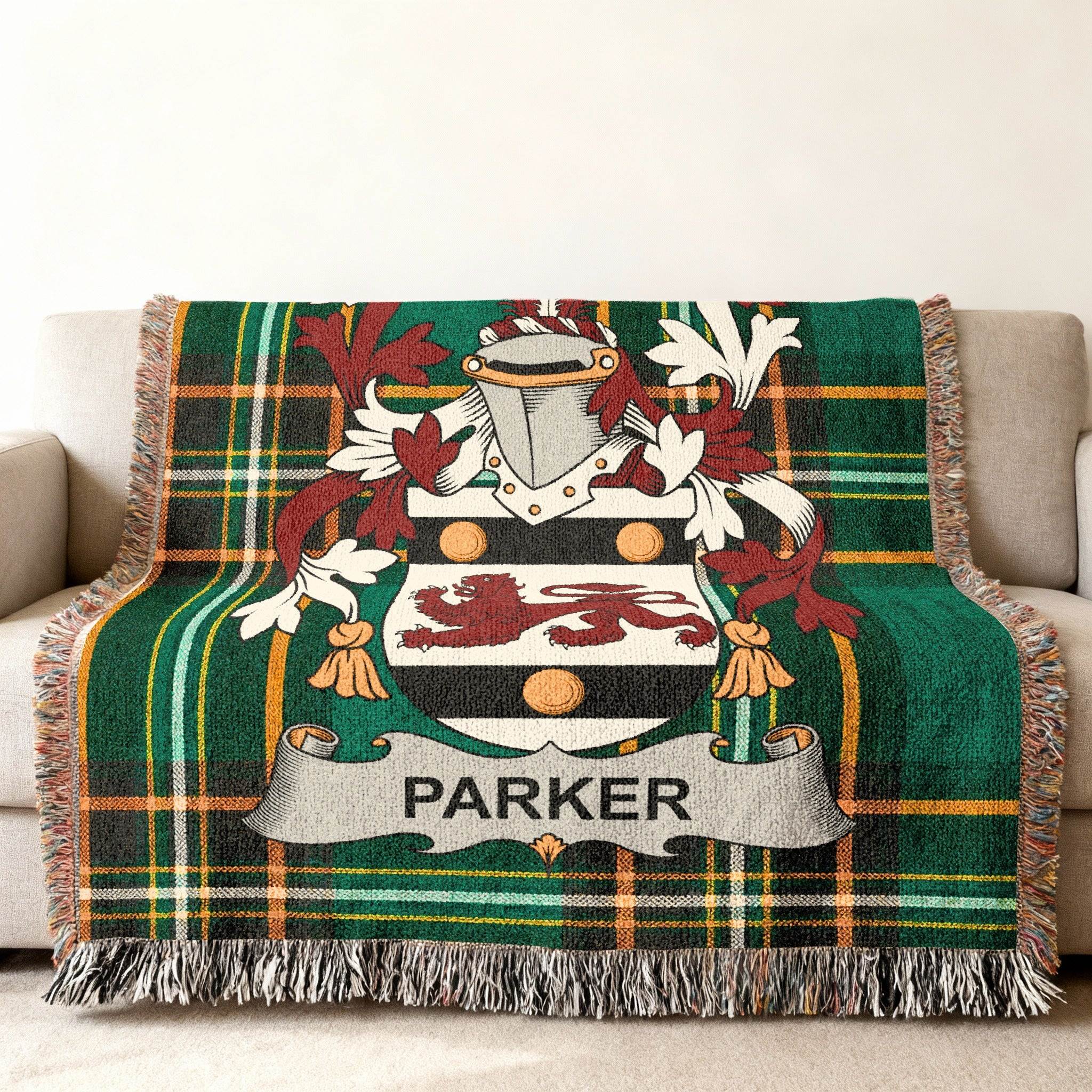 Woven blanket with green plaid and the Parker family crest.
