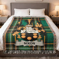 Tartan blanket with Nixon family crest centered on a bed.