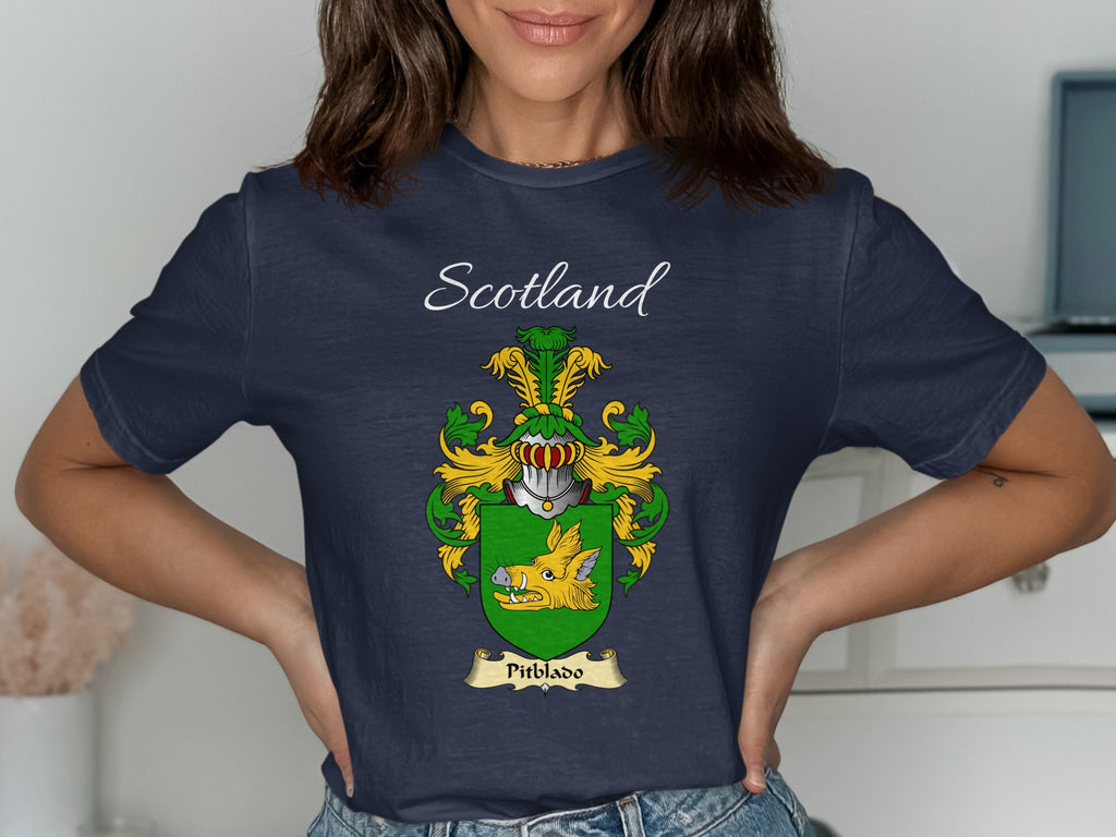Model wearing the navy Pitblado family crest T-shirt featuring “Scotland” and the surname banner.