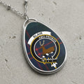 Blair clan Scottish tartan necklace with clan crest on tartan background