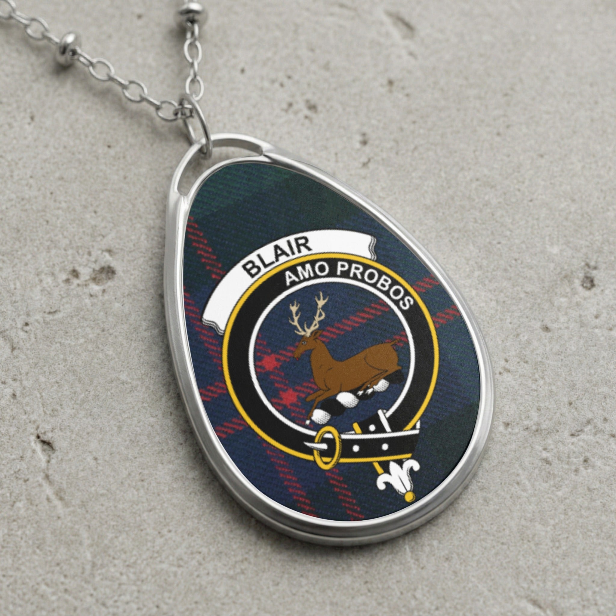 Blair clan Scottish tartan necklace with clan crest on tartan background