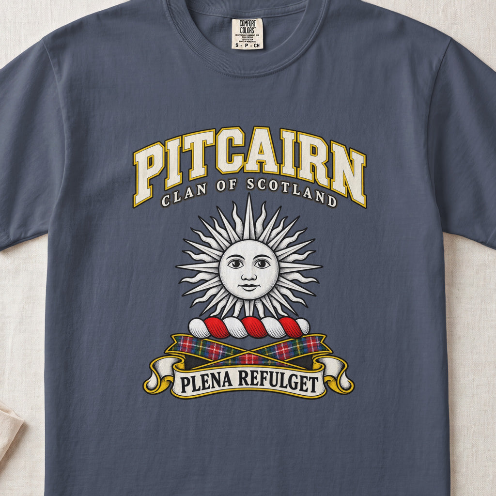Pitcairn Scottish clan T-shirt in Midnight, front view with a silver sun with a face and motto design.