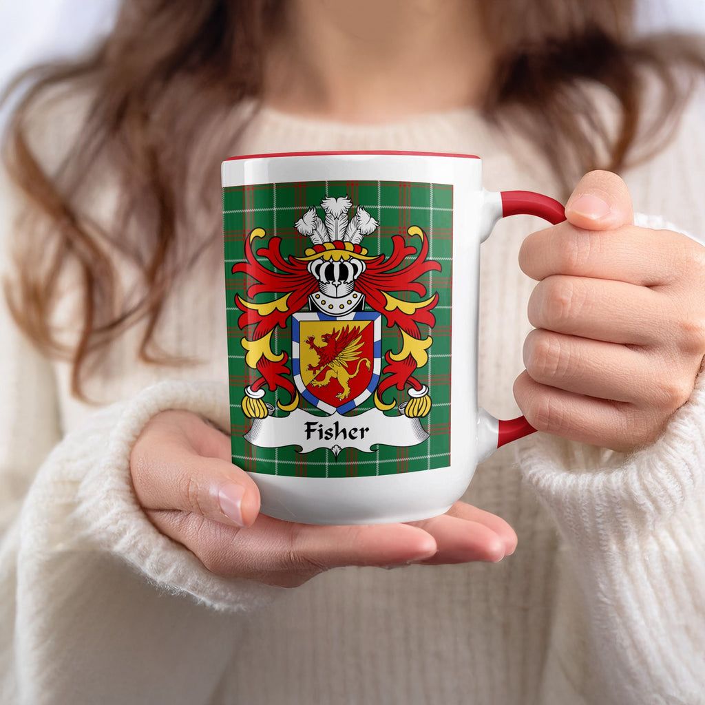 Mug with Fisher family crest on green plaid pattern.