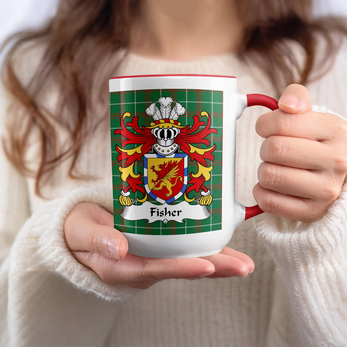 Mug with Fisher family crest on green plaid pattern.