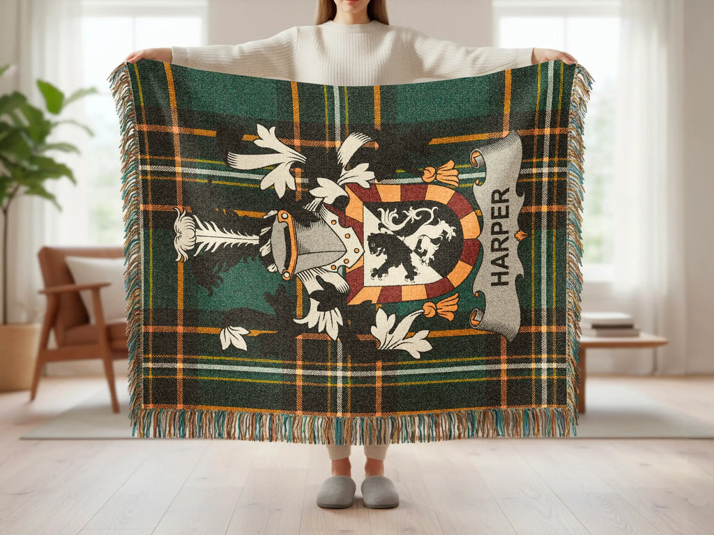 Green tartan blanket with a heraldic crest and the name "HARPER".
