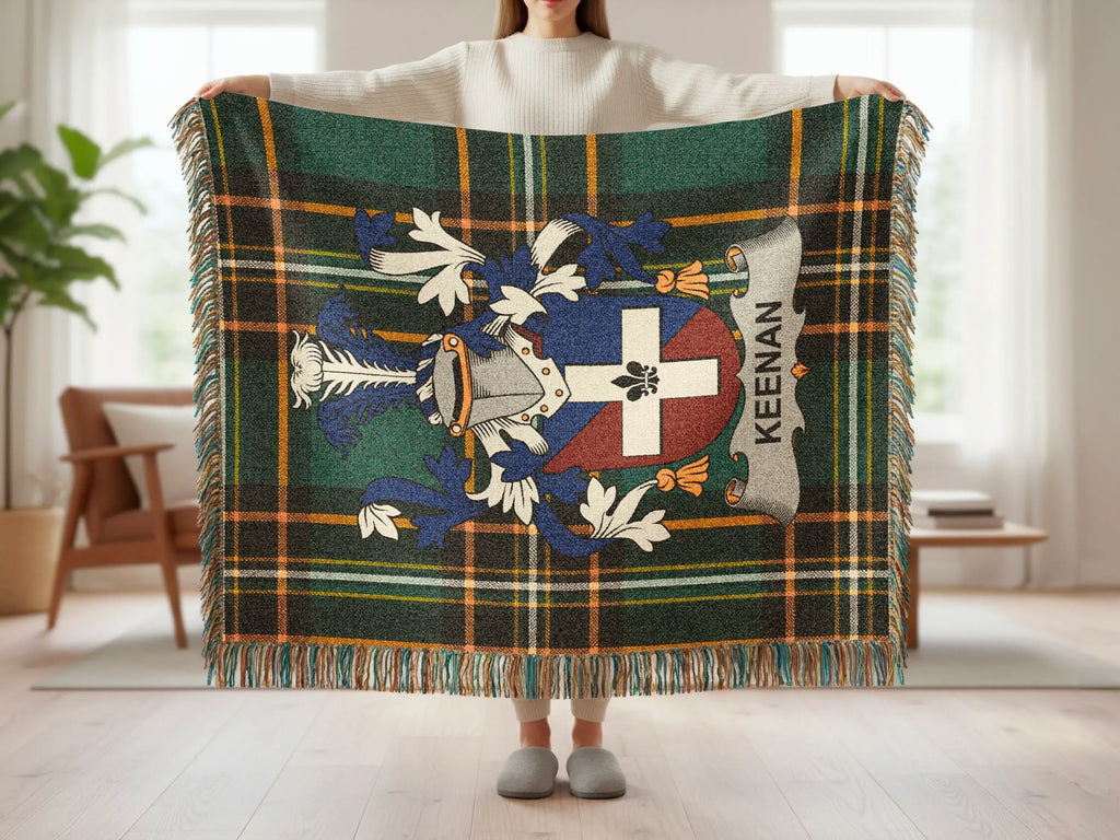 Green and blue plaid blanket with a heraldic crest and "KEENAN" text.