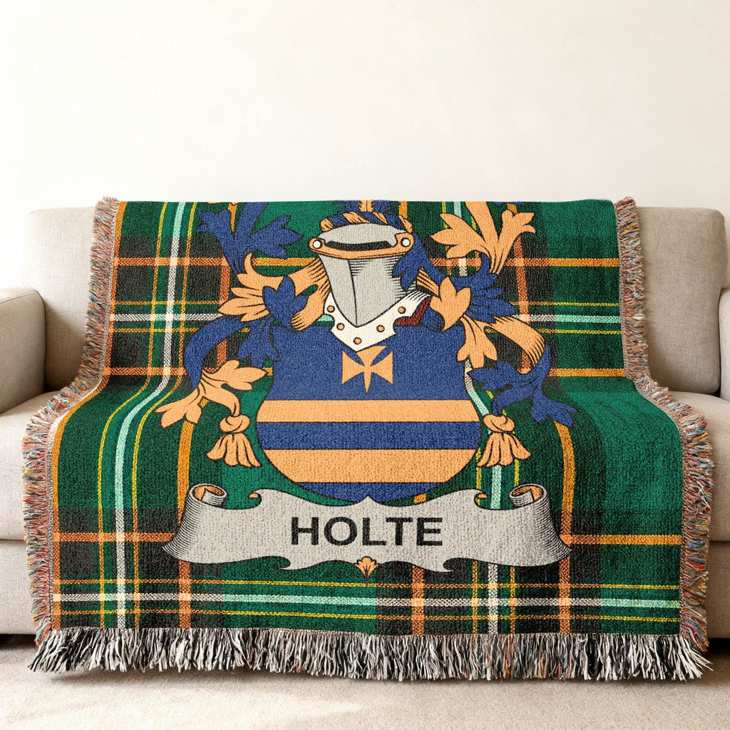 Woven throw blanket featuring the Holte family crest on a plaid background.