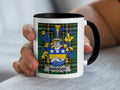 White mug with black rim featuring a blue and gold crest with "BOROUGH" text.