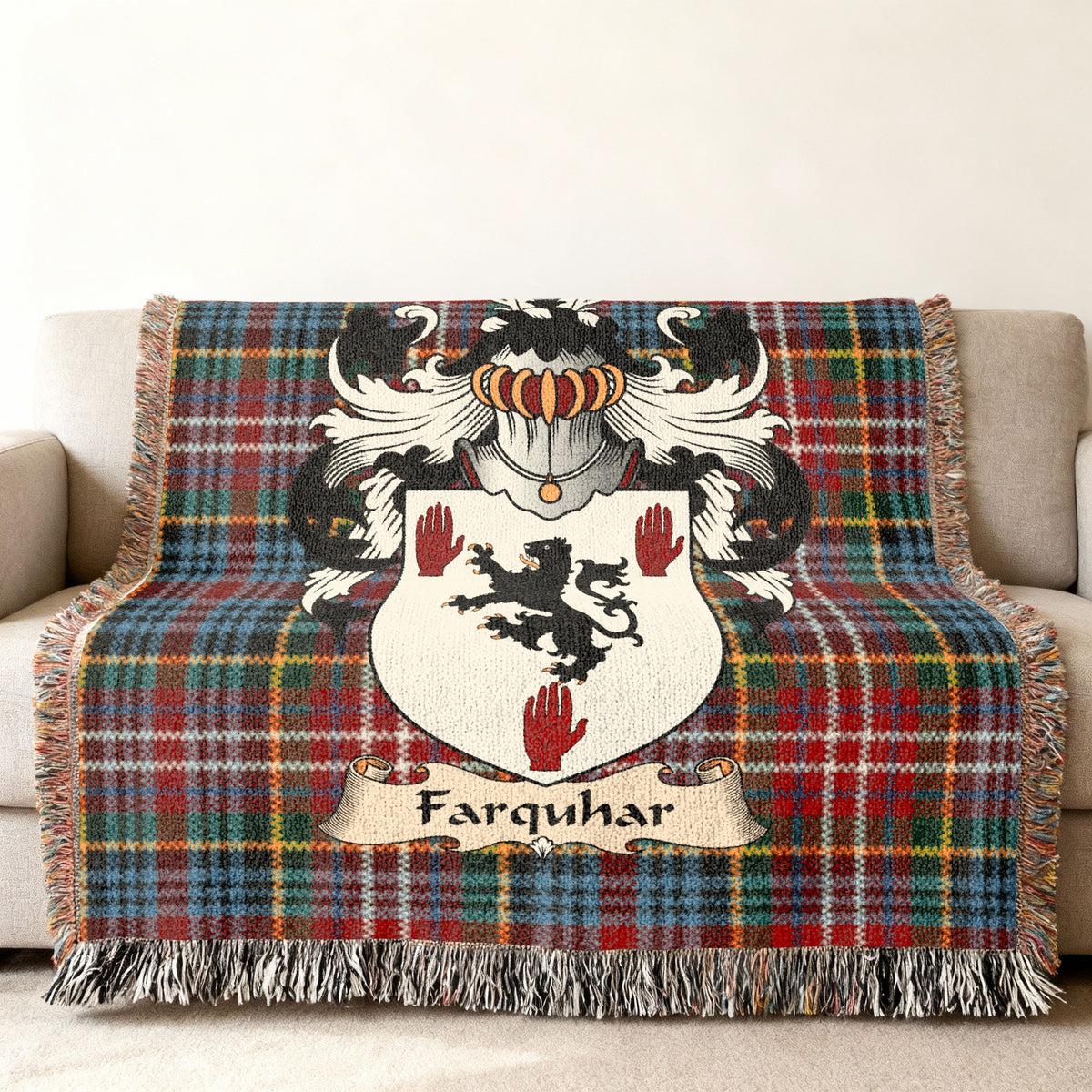 Farquhar family crest emblem on a Caledonia tartan woven blanket