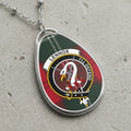 Lennox clan Scottish tartan necklace with clan crest on tartan background