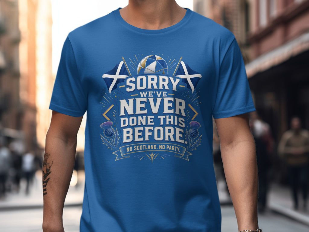 Blue t-shirt with Scottish flag, thistle, and "Sorry we've never done this before. No Scotland. No Party." text.