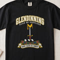 Glendinning Scottish clan T-shirt in Black, front view with an upright sword beneath a gold pennon and motto design.
