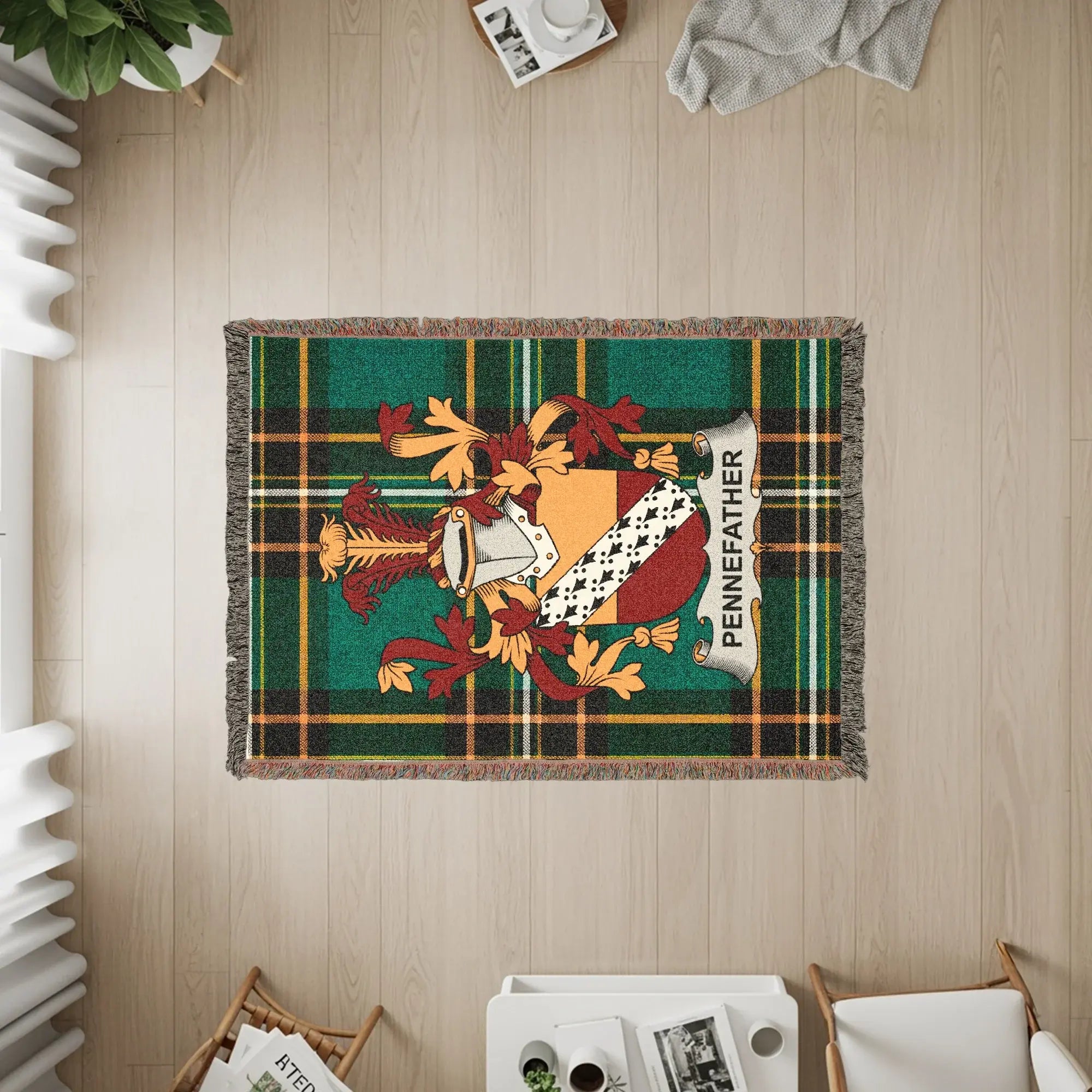 Woven blanket with Pennefather family crest on tartan background.