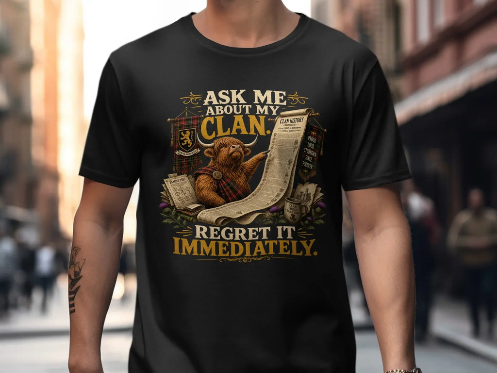 Black t-shirt with Highland cow and humorous text about clan history.