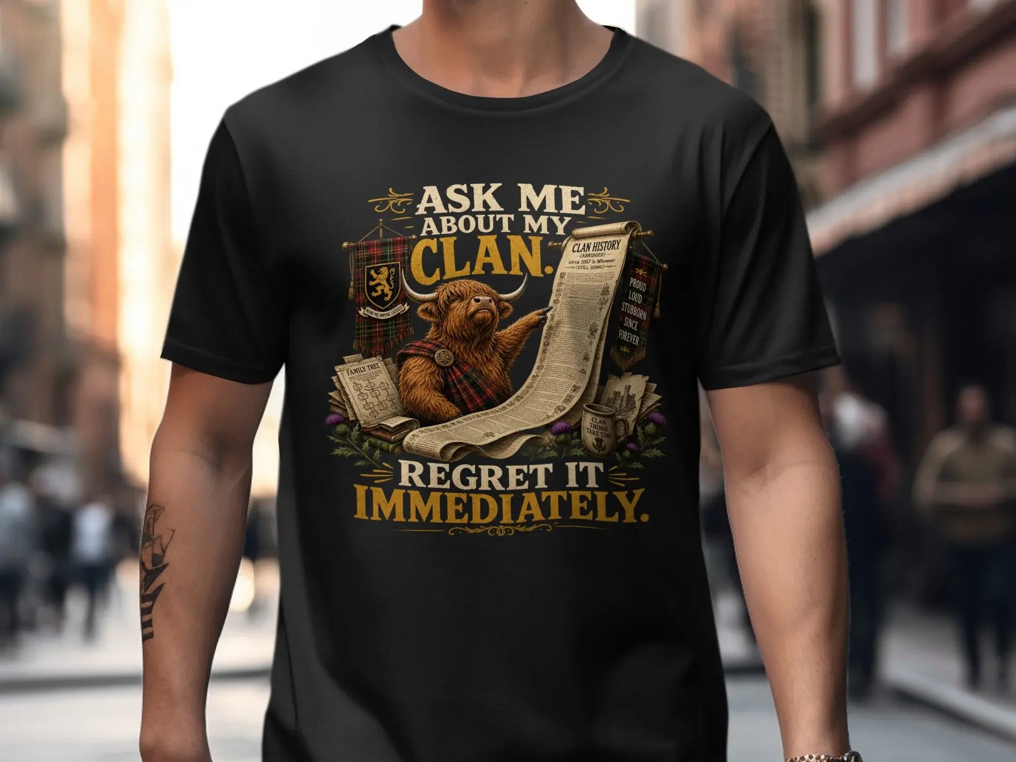 Black t-shirt with Highland cow and humorous text about clan history.