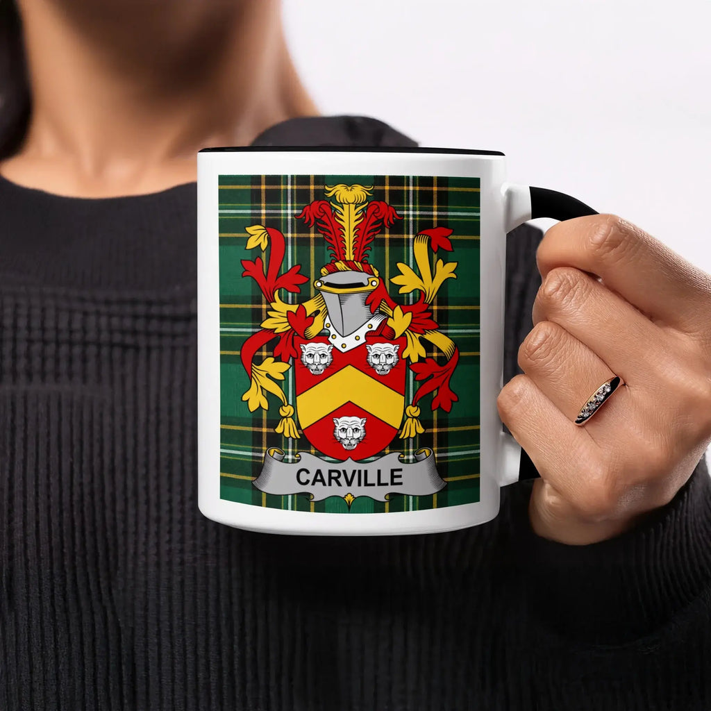 Black mug with Carville family crest on a green plaid background.