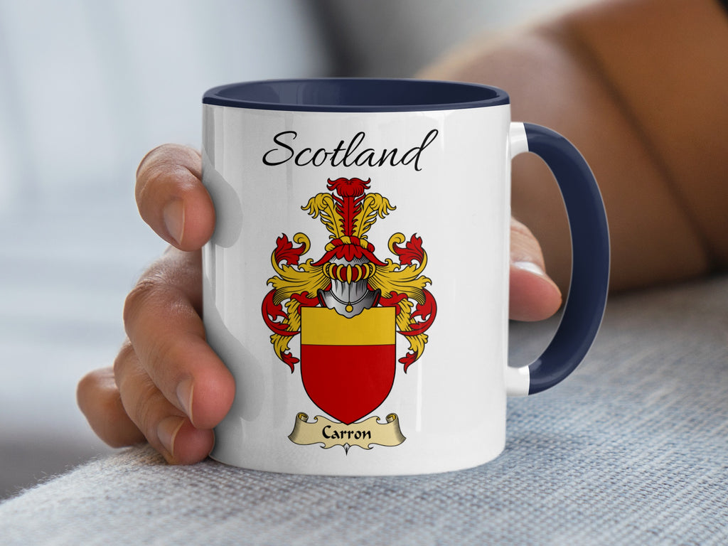 White Carron heritage mug with navy handle and interior, displaying “Scotland” and the colourful family emblem.