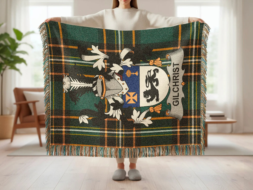 Tartan blanket with Gilchrist family crest and fringes.
