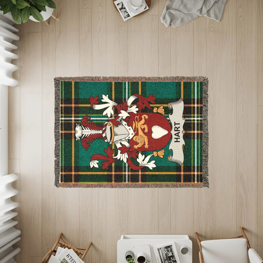 Tapestry rug with the Hart family crest in a tartan plaid design.