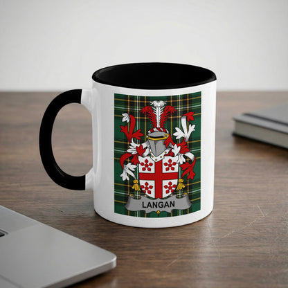 White mug with black rim featuring the Langan family crest on a plaid background.