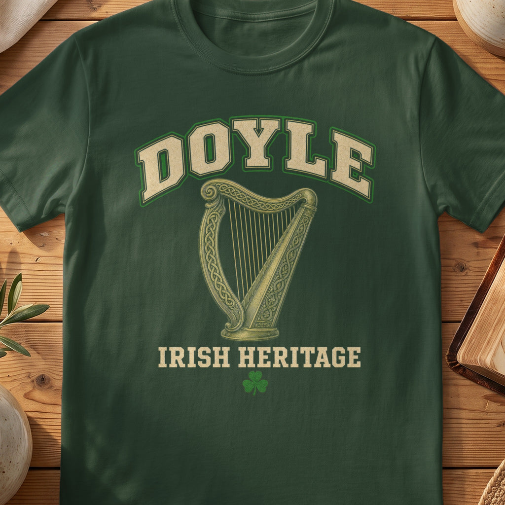 Doyle Irish harp T-shirt in Forest Green, with cream surname lettering, a gold-toned harp, green shamrock and “Irish Heritage” text.