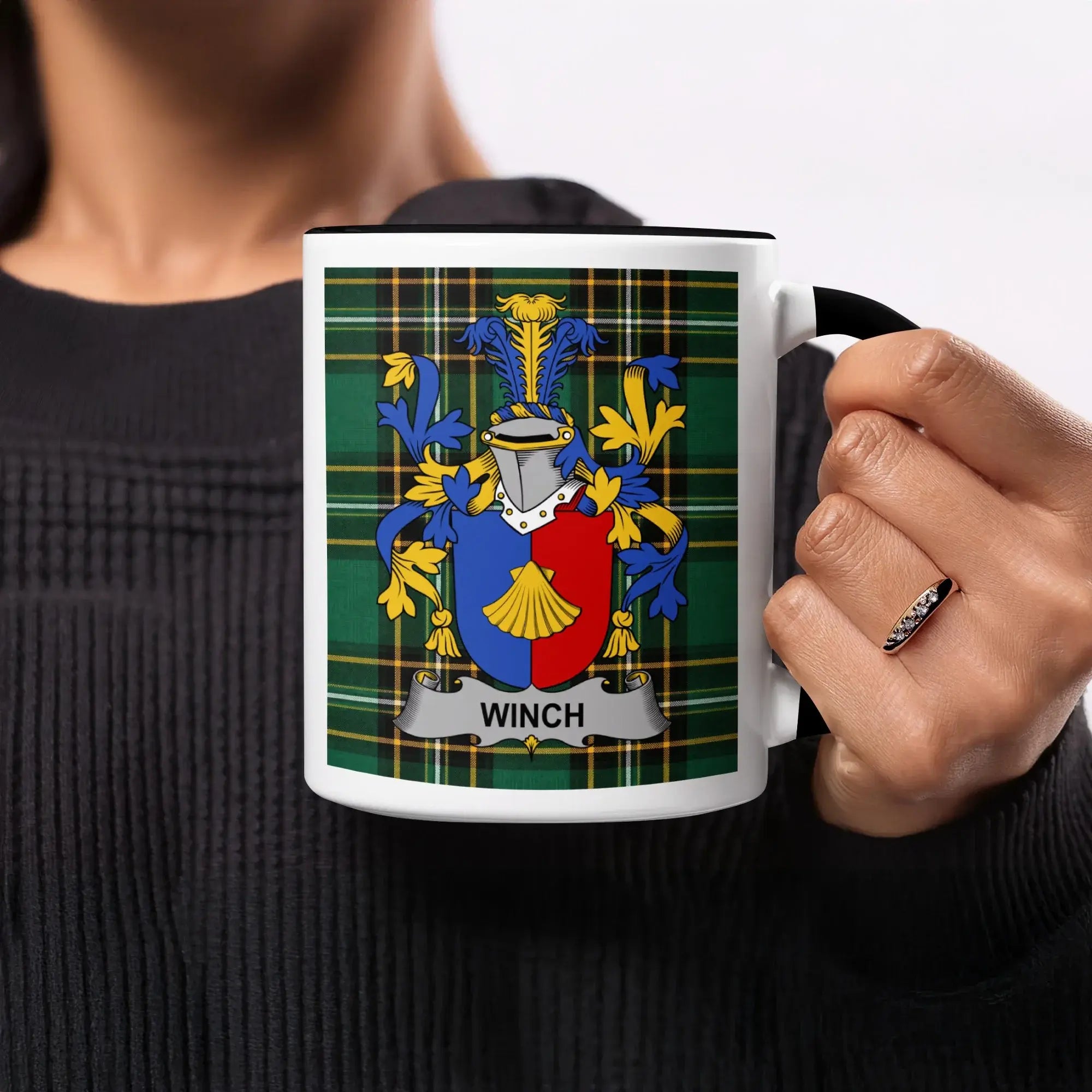 Black mug with green tartan pattern and Winch family crest.