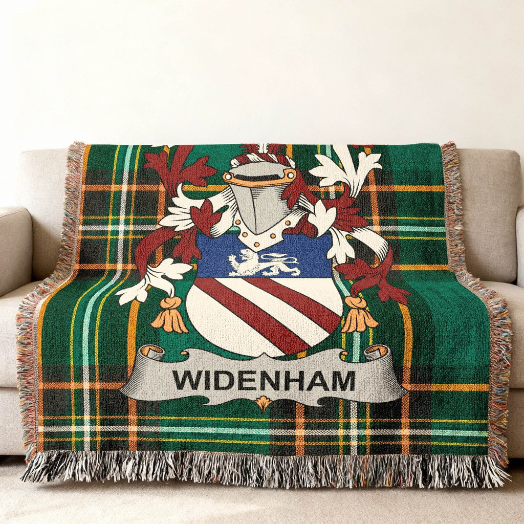 WIDENHAM family crest on a green tartan woven throw blanket.