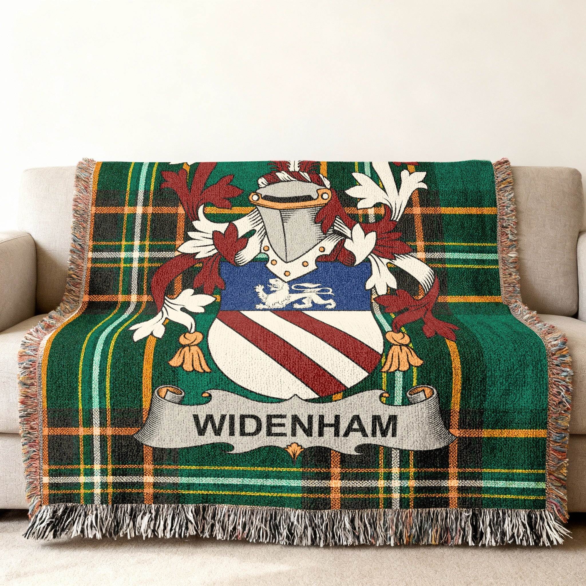 WIDENHAM family crest on a green tartan woven throw blanket.
