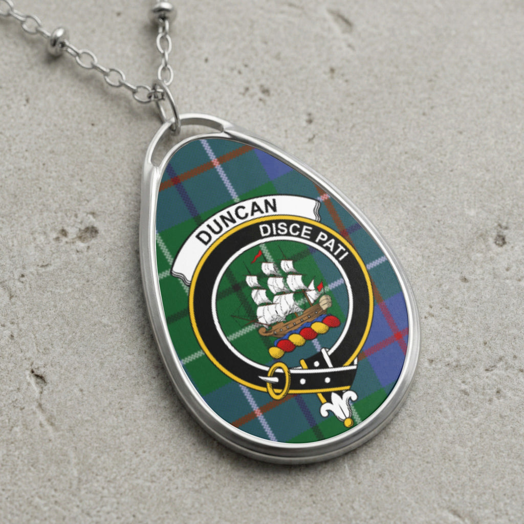 Duncan clan Scottish tartan necklace with clan crest on tartan background