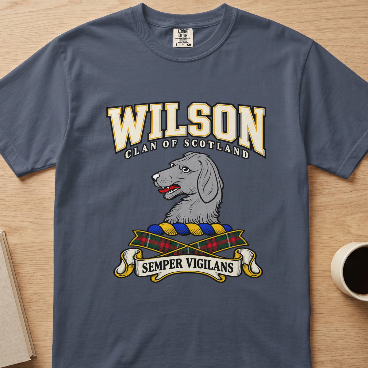Wilson gray dog’s-head crest graphic on a slate blue Comfort Colors T-shirt, front view