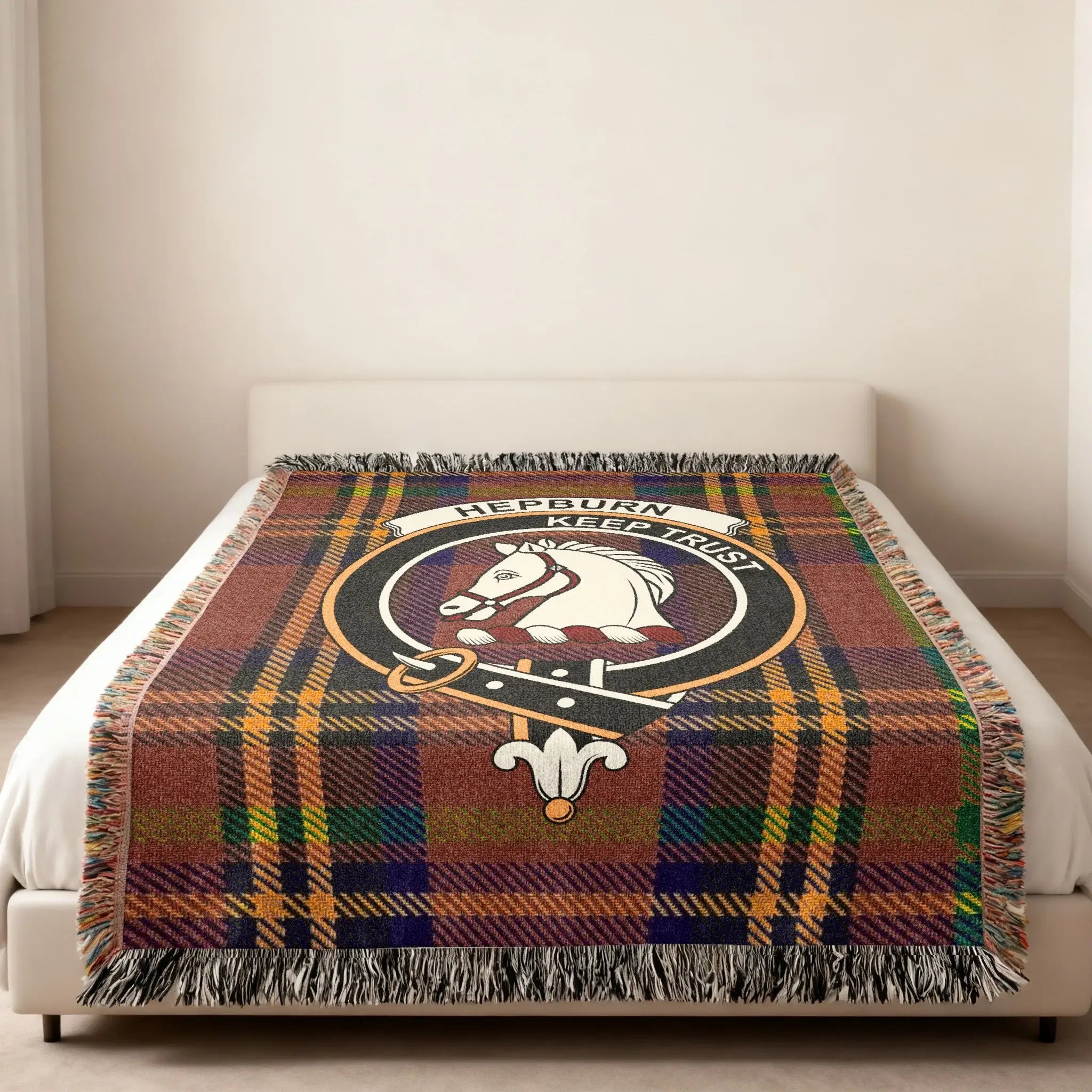 Hepburn Keep Trust horse design woven blanket — heraldic crest at centre, fringe edge visible