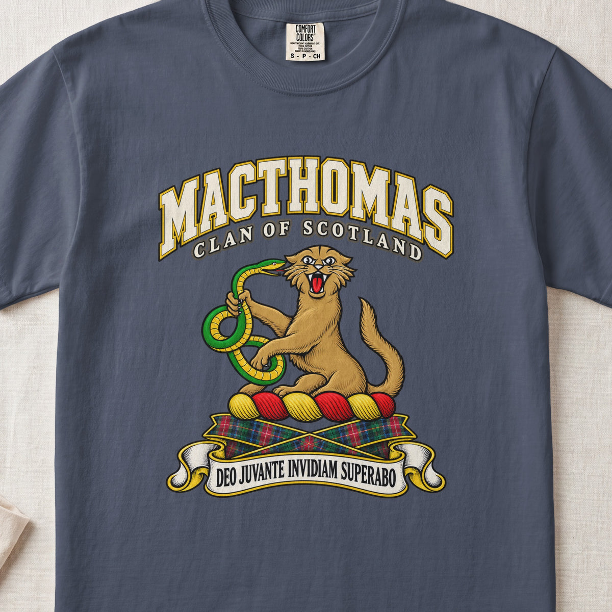 MacThomas Scottish clan T-shirt in Midnight, front view with a golden wildcat holding a green snake and motto banner.